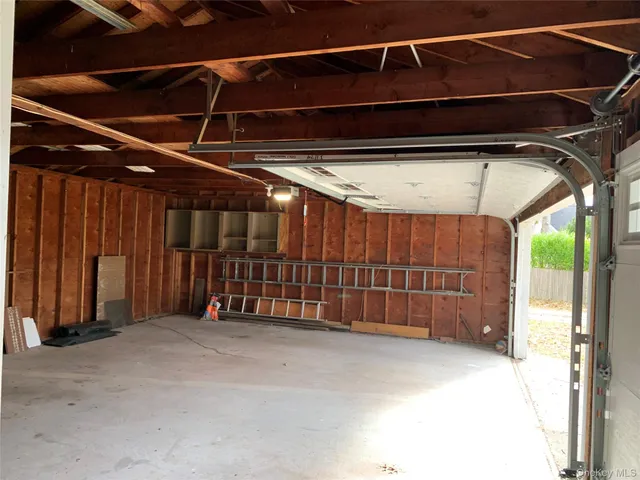 a view of an empty room with a garage