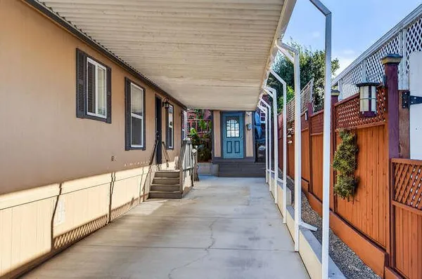 a view of a balcony with wooden floor