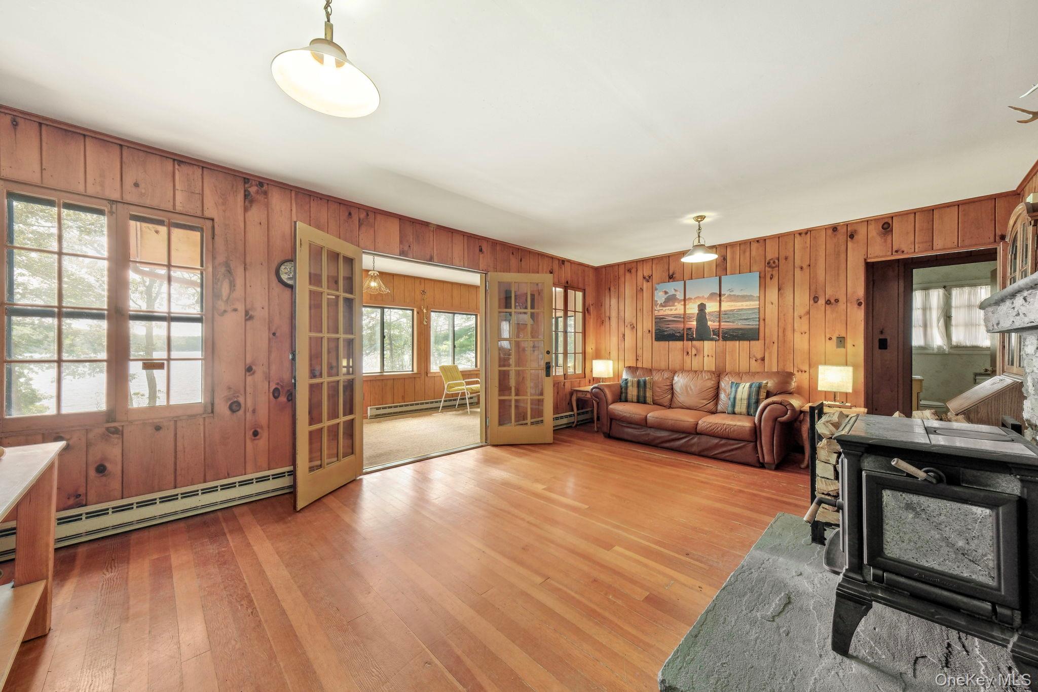 194 Canal Road Wurtsboro, NY 12790 - Photo 14 of 43 a living room with furniture and a large window