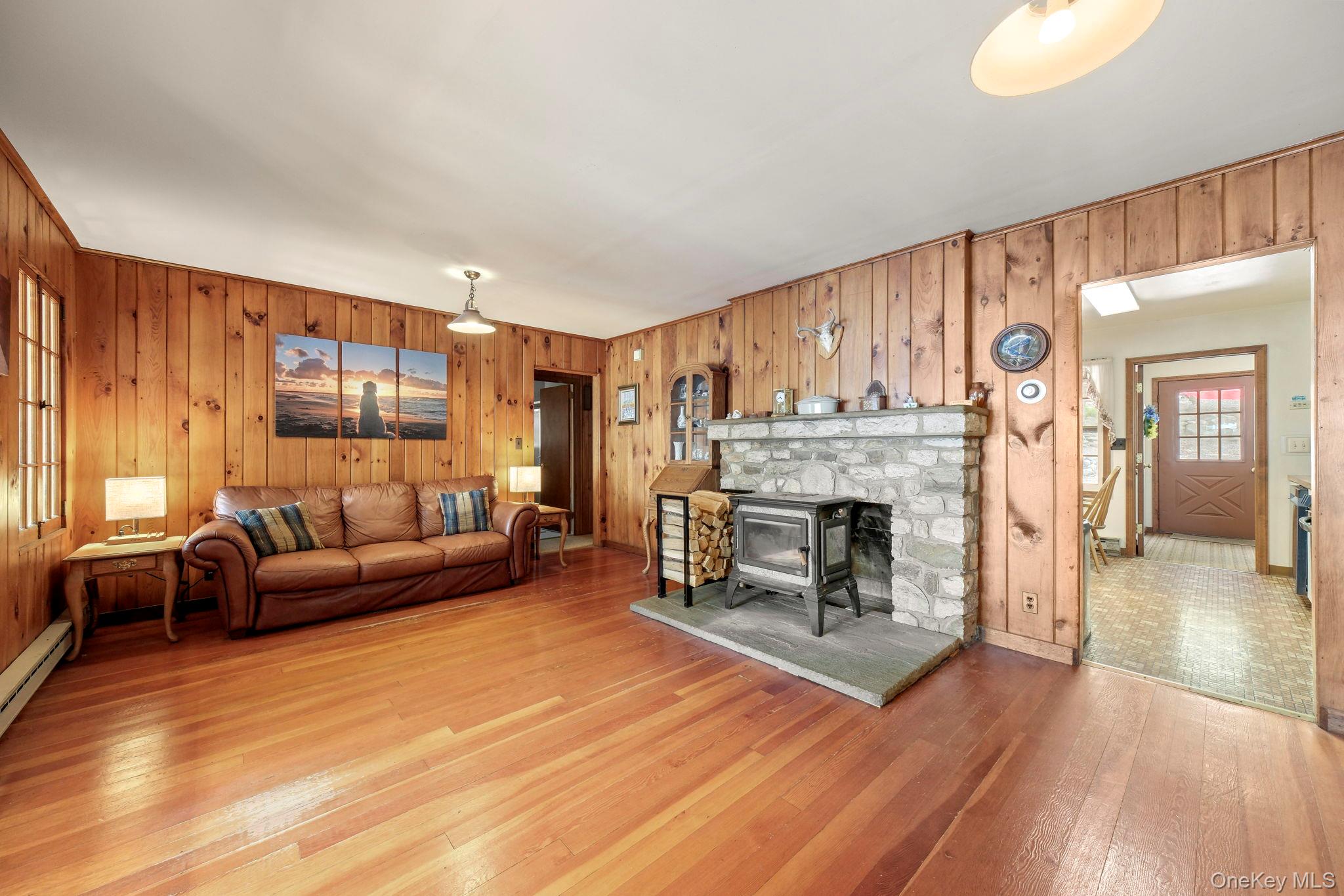 194 Canal Road Wurtsboro, NY 12790 - Photo 15 of 43 a living room with furniture and a fireplace