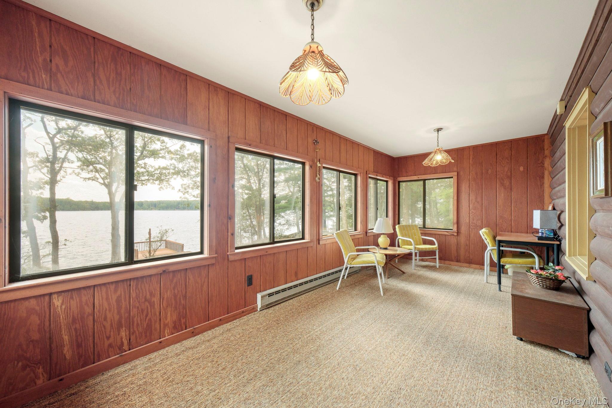 194 Canal Road Wurtsboro, NY 12790 - Photo 20 of 43 a living room with furniture and large windows
