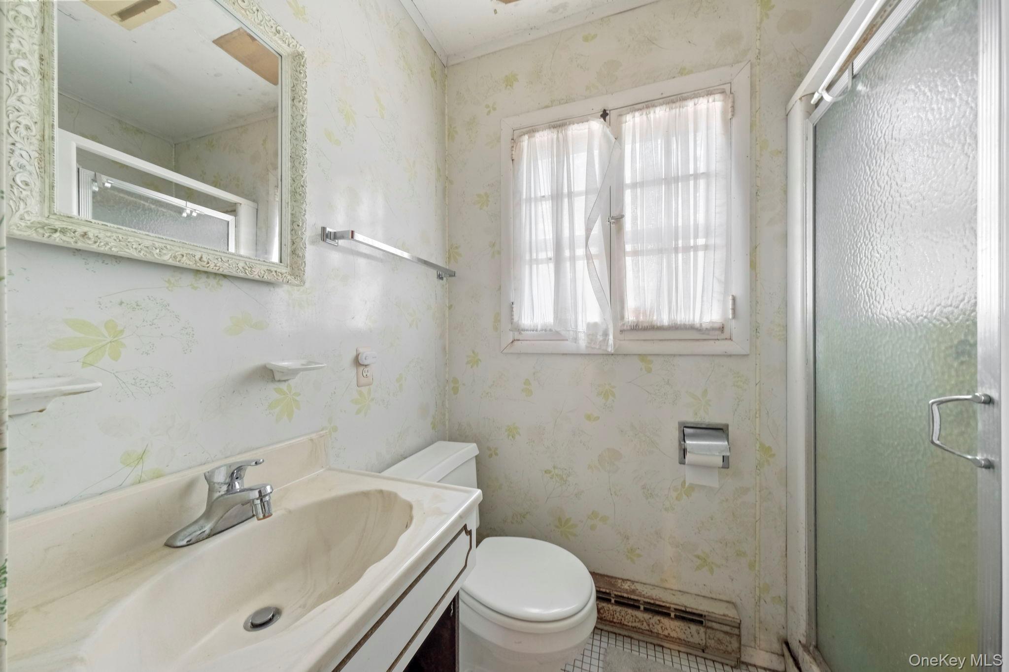 194 Canal Road Wurtsboro, NY 12790 - Photo 23 of 43 a bathroom with a sink a toilet and shower