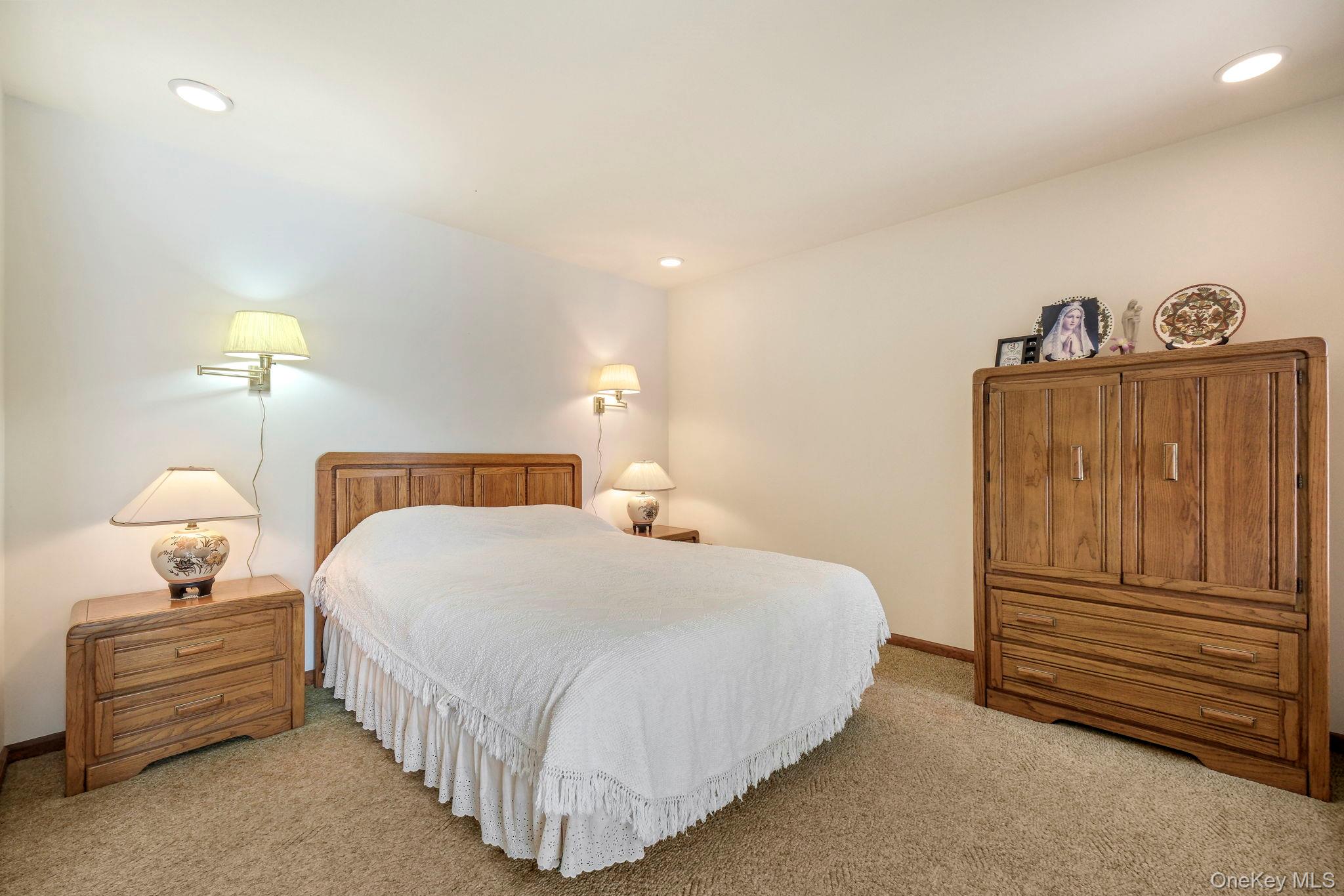 194 Canal Road Wurtsboro, NY 12790 - Photo 28 of 43 a bedroom with a bed and a lamp