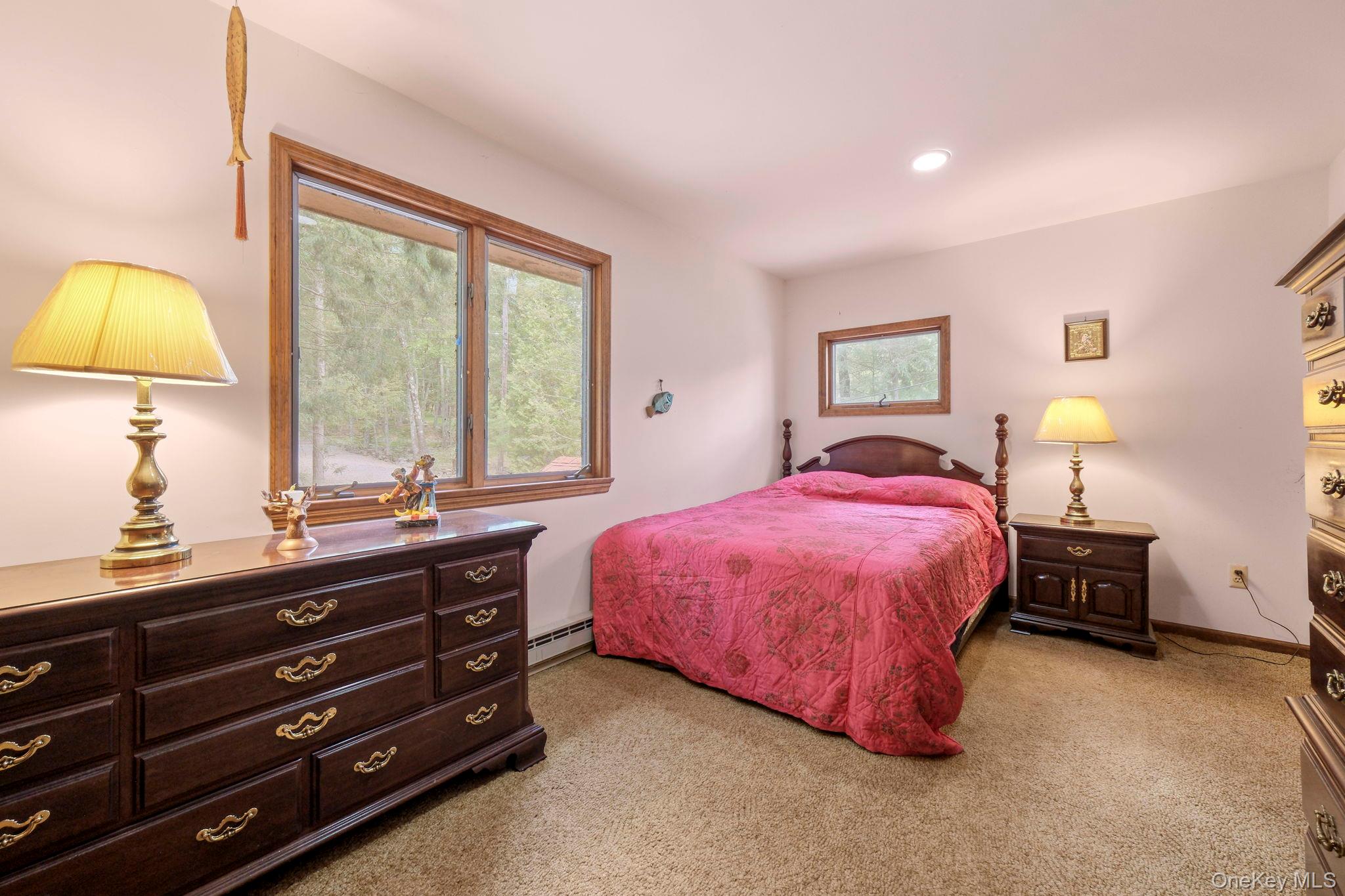 194 Canal Road Wurtsboro, NY 12790 - Photo 34 of 43 a bed room with a bed and a lamp