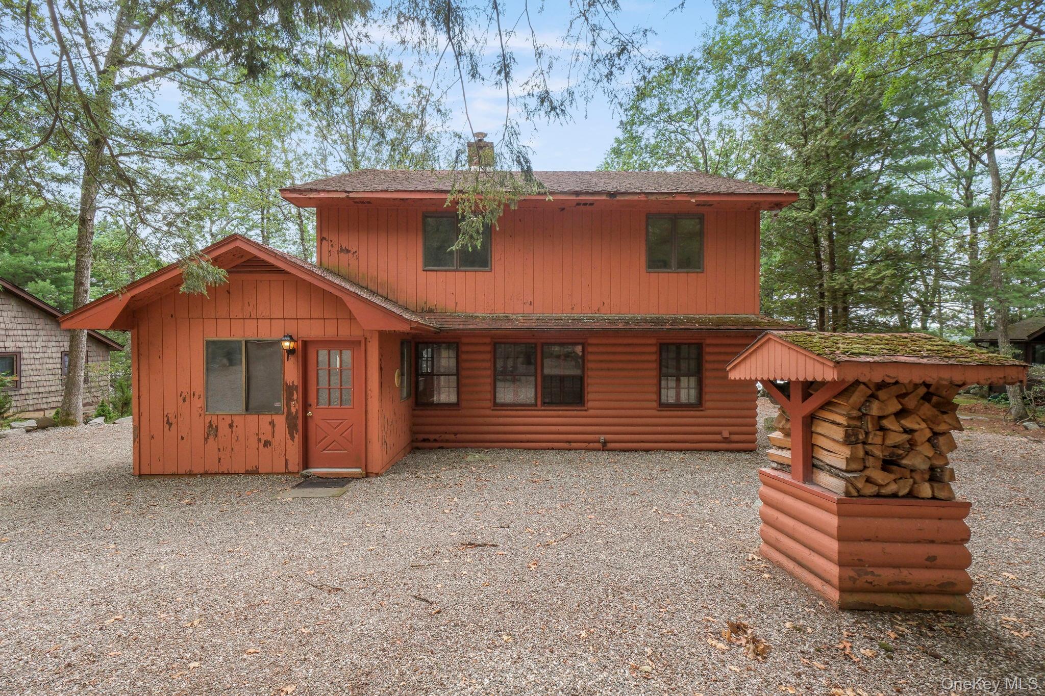 194 Canal Road Wurtsboro, NY 12790 - Photo 7 of 43 a front view of a house with a yard