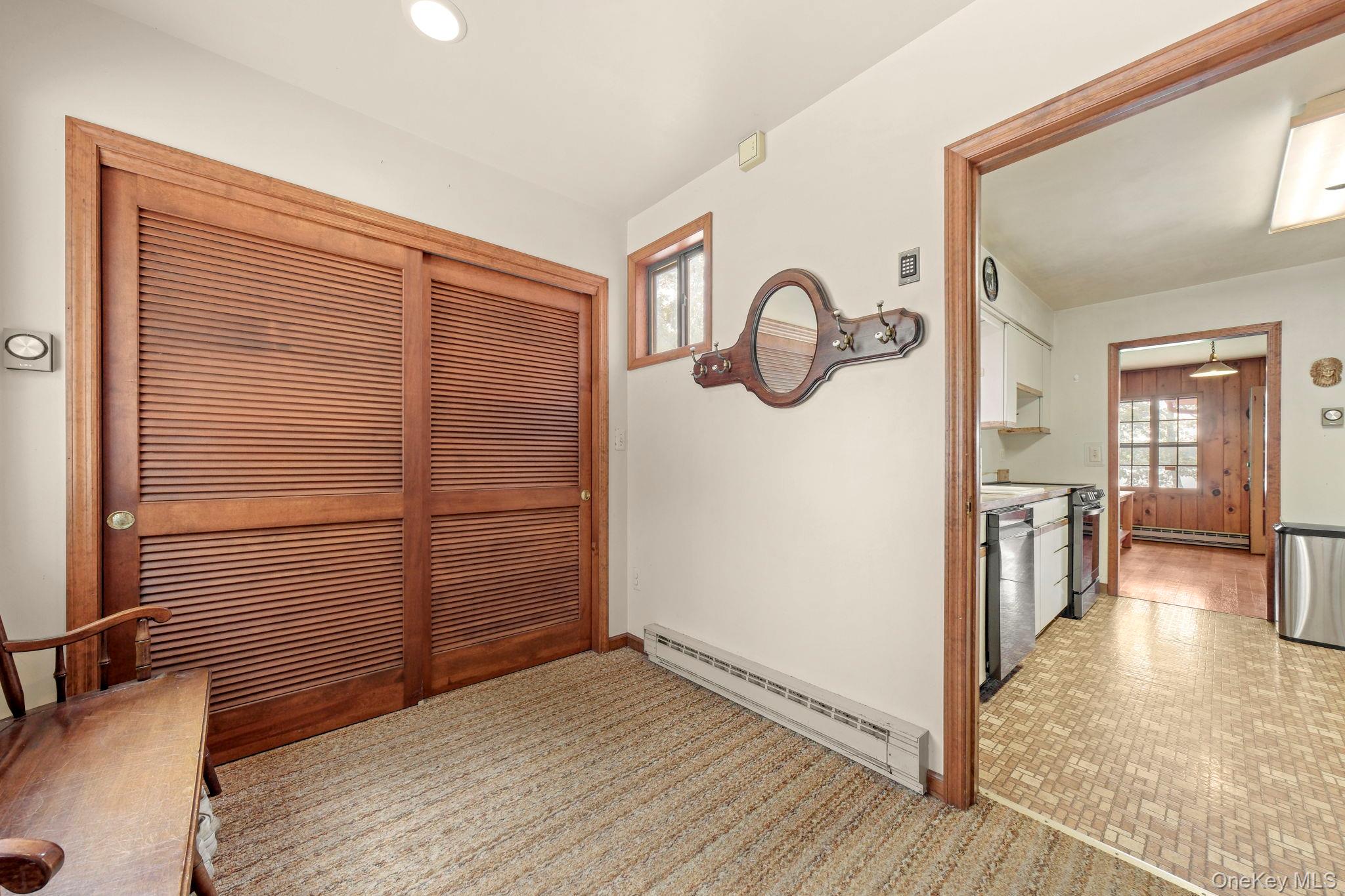 194 Canal Road Wurtsboro, NY 12790 - Photo 8 of 43 a view of a hallway with wooden floor and furniture