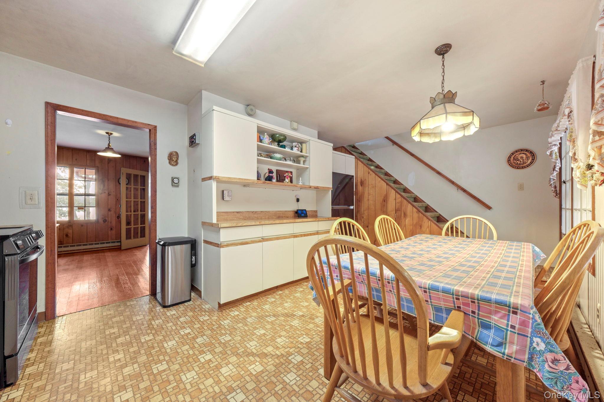 194 Canal Road Wurtsboro, NY 12790 - Photo 10 of 43 a view of a livingroom with furniture stairs wooden floor and windows