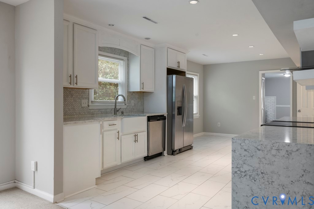 207 Missionary Ridge Hampton, VA 23669 - Photo 9 of 32 Kitchen featuring white cabinetry, stainless steel