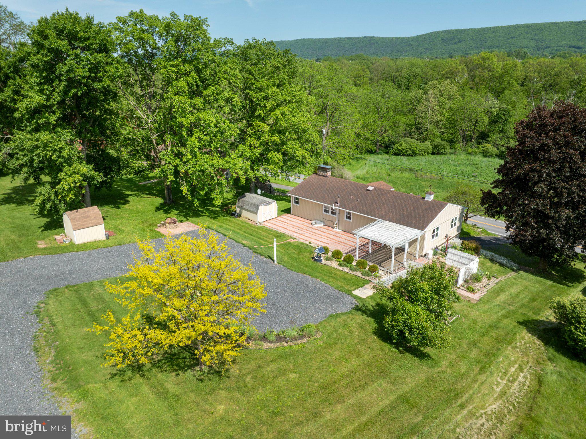 1639 Houserville Road State College, PA 16801 - Photo 49 of 54 Serene countryside retreat with lush greenery.