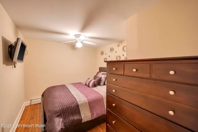 a bedroom with a bed and a night stand