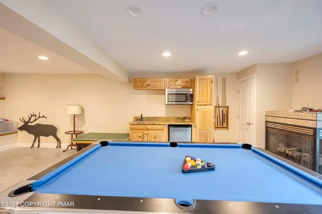 a bathroom with a sink a toilet and shower curtain