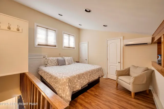 a front view of a house with a garden and plants