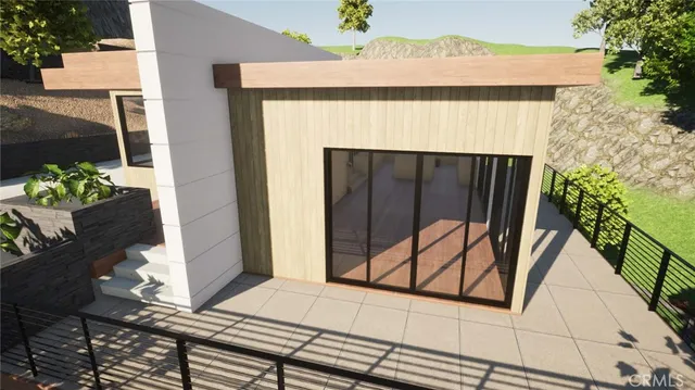 a front view of a house with a potted plant