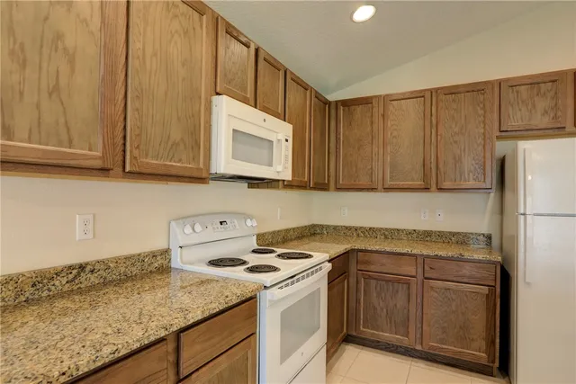 a view of an empty room with a bathroom