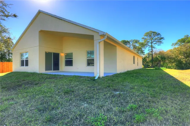 a view of an empty room with windows