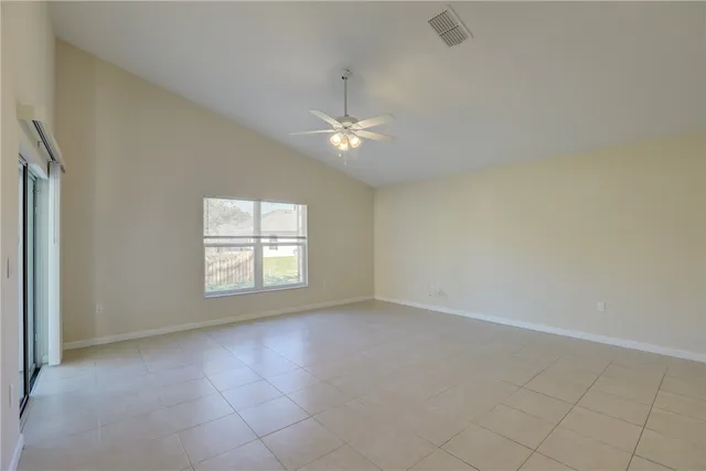 a view of a kitchen with a sink and a window
