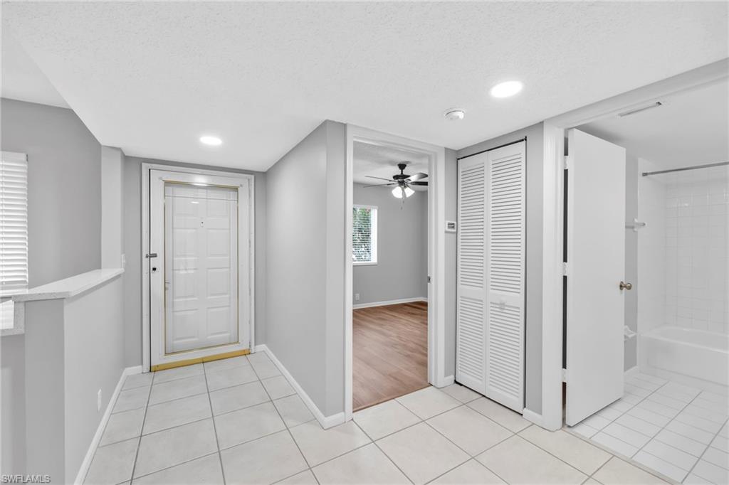 7791 Esmeralda Way, Unit L103 Naples, FL 34109 - Photo 3 of 22 a view of entryway with white walls