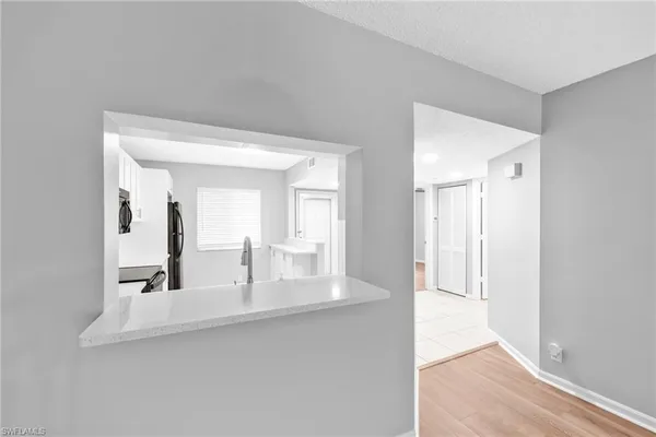 a view of a bathroom with sink and mirror