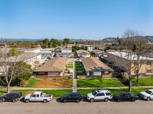 an aerial view of a building with parking space and parking space