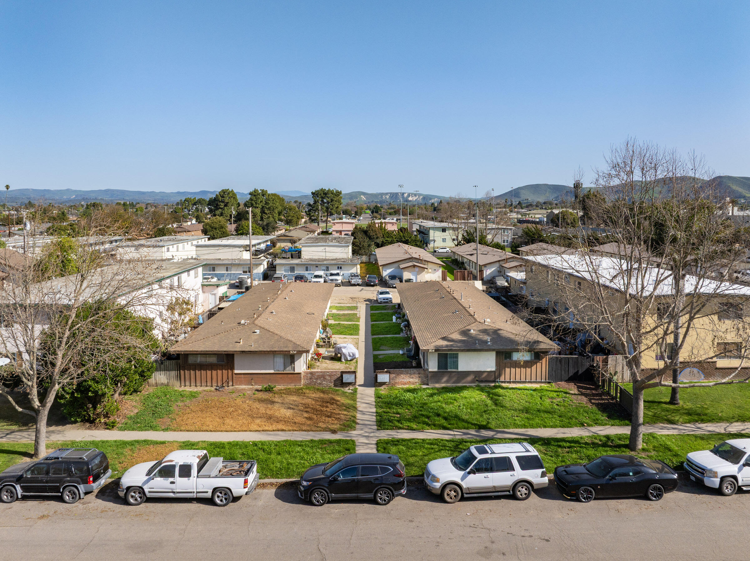 an aerial view of a building with parking space and parking space