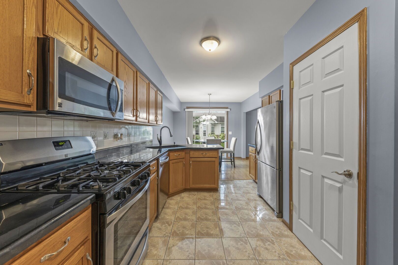 16727 South Sunset Ridge Court Lockport, IL 60441 - Photo 11 of 30 a kitchen with a stove and a refrigerator