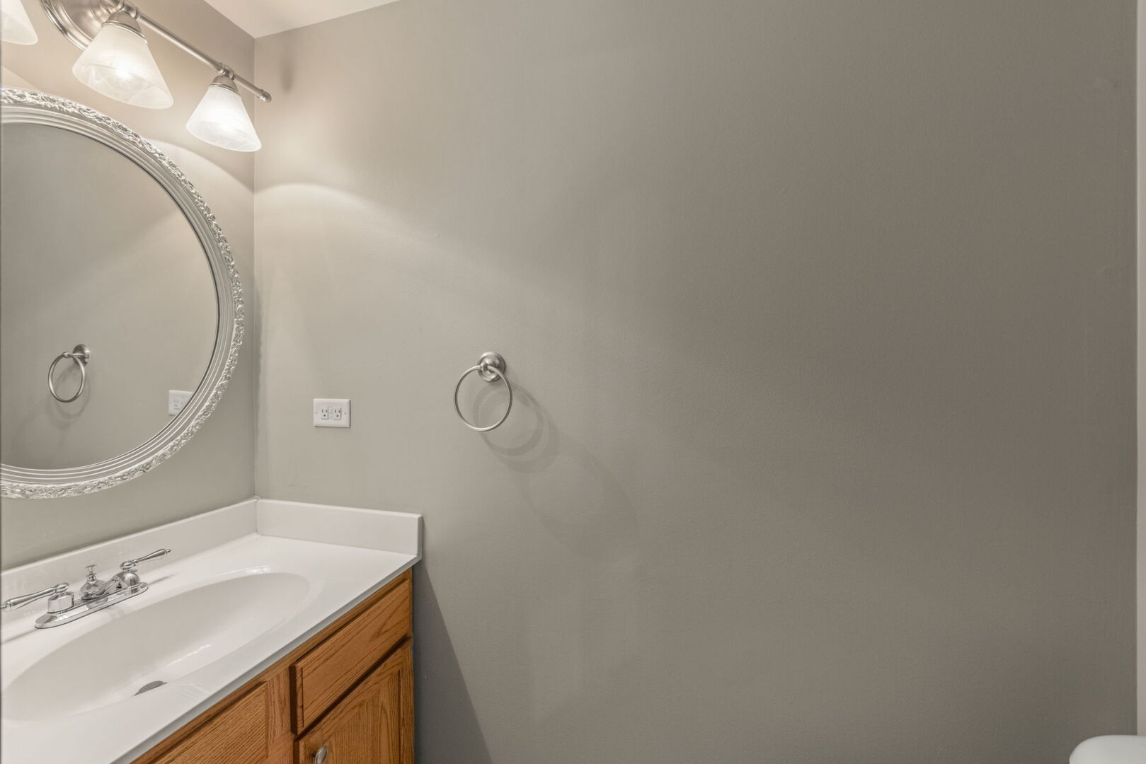 16727 South Sunset Ridge Court Lockport, IL 60441 - Photo 12 of 30 a bathroom with a sink and a mirror