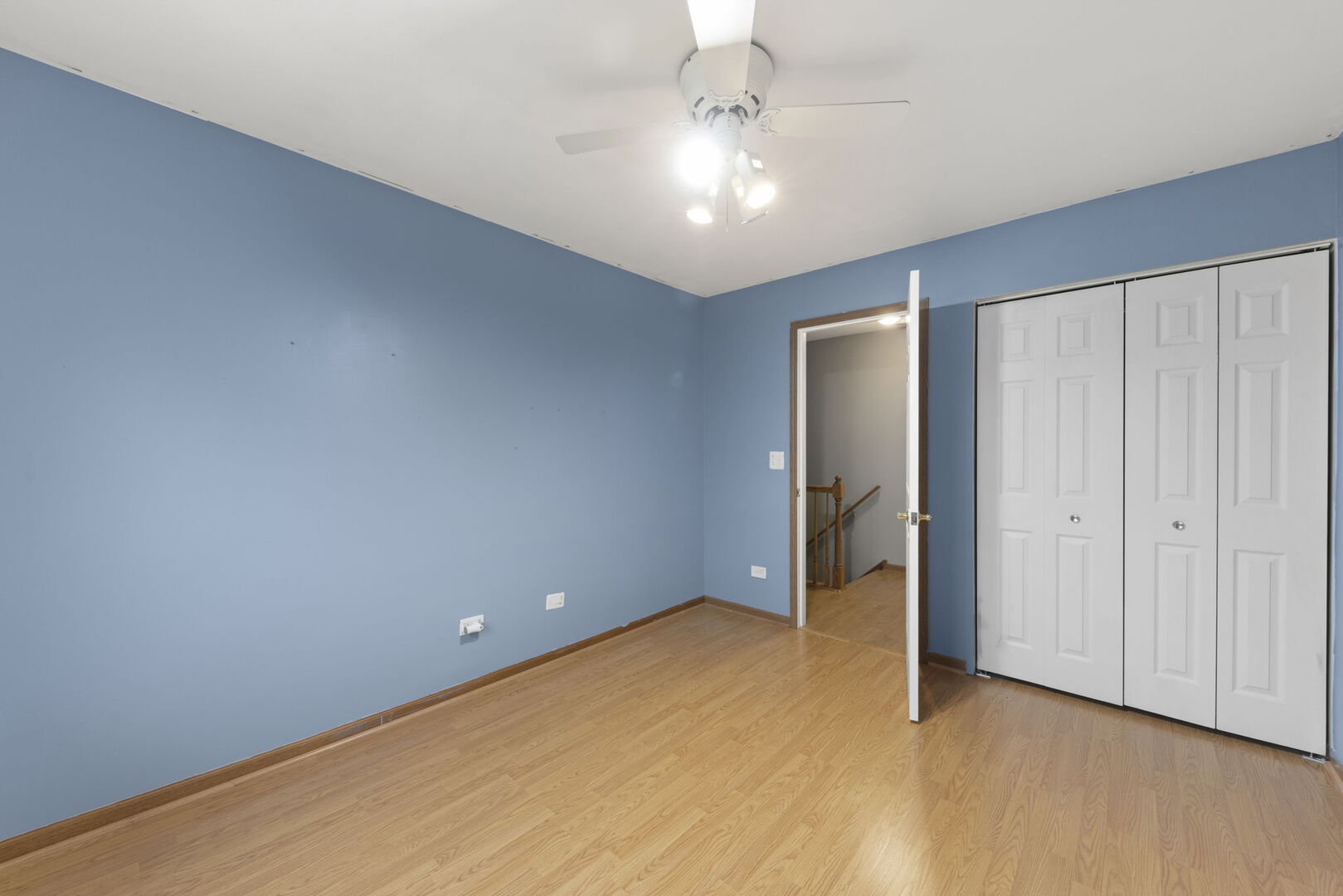 16727 South Sunset Ridge Court Lockport, IL 60441 - Photo 16 of 30 a view of an empty room with closet and chandelier fan