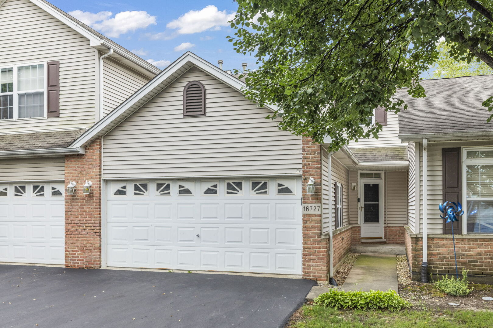 16727 South Sunset Ridge Court Lockport, IL 60441 - Photo 2 of 30 a front view of a house with a garage