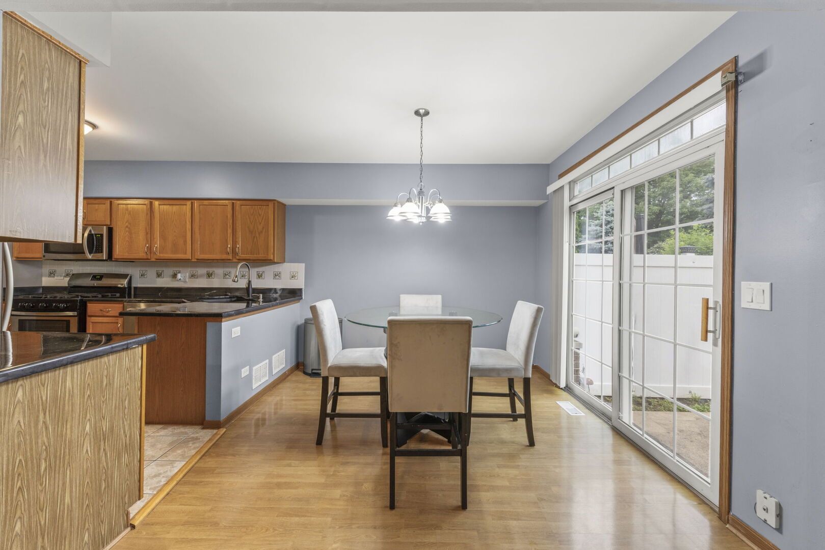 16727 South Sunset Ridge Court Lockport, IL 60441 - Photo 8 of 30 a kitchen with granite countertop a stove a sink and a refrigerator