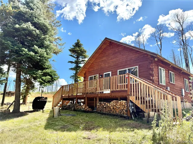 a view of a house with a yard porch and sitting area