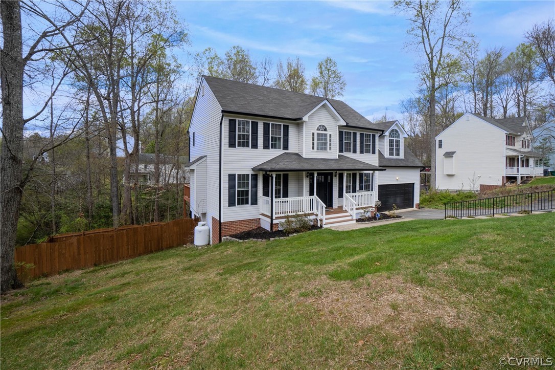 5324 Beaver Spring Road Midlothian, VA 23112 - Photo 5 of 38 a front view of a house with a garden