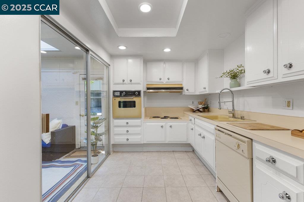 1833 Skycrest Drive, Unit 2 Walnut Creek, CA 94595 - Photo 12 of 28 a kitchen with a sink window and cabinets