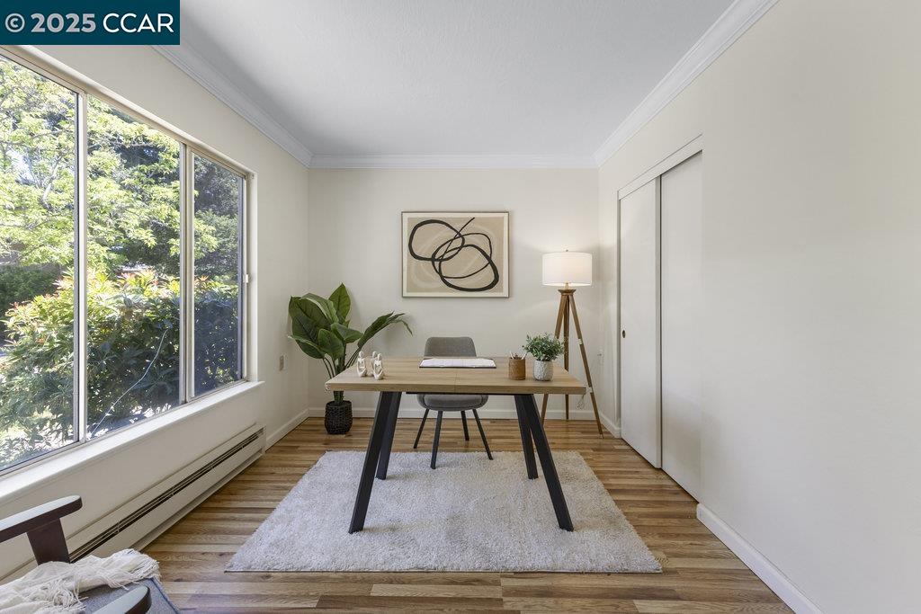1833 Skycrest Drive, Unit 2 Walnut Creek, CA 94595 - Photo 15 of 28 a view of a room with furniture and wooden floor