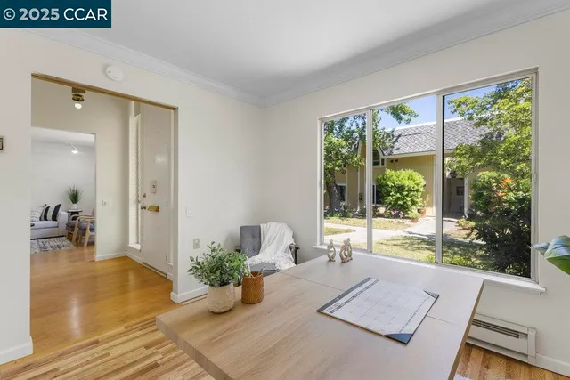 a bed room with a bed and large windows