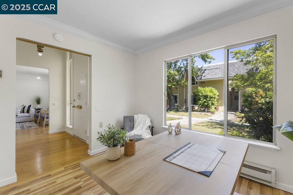 1833 Skycrest Drive, Unit 2 Walnut Creek, CA 94595 - Photo 17 of 28 a bed room with a bed and large windows