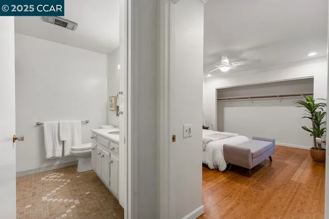 a room with a bed and a view of bedroom