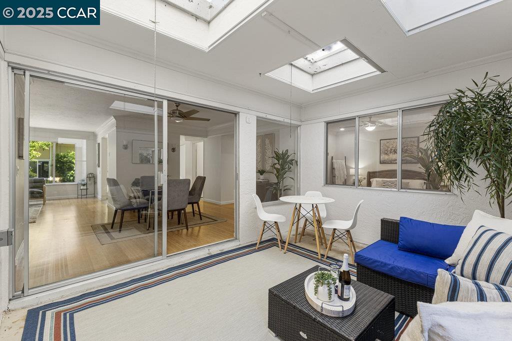 1833 Skycrest Drive, Unit 2 Walnut Creek, CA 94595 - Photo 26 of 28 a living room with furniture and a table
