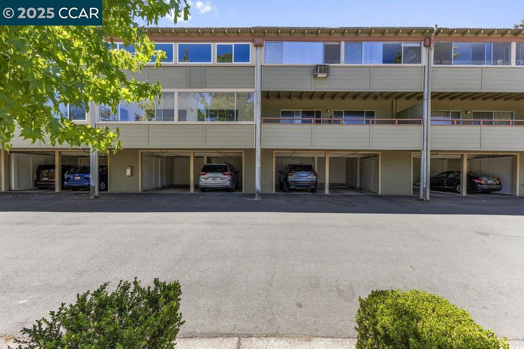 1833 Skycrest Drive, Unit 2 Walnut Creek, CA 94595 - Photo 28 of 28 a front view of a building with garden
