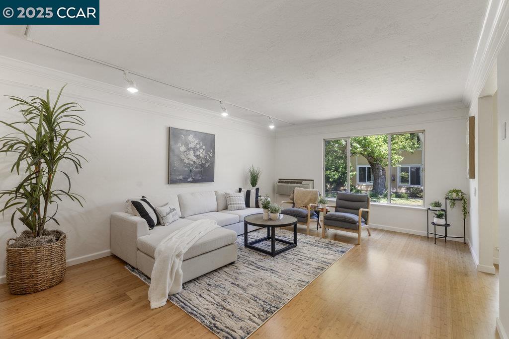 1833 Skycrest Drive, Unit 2 Walnut Creek, CA 94595 - Photo 5 of 28 a living room with furniture and a large window