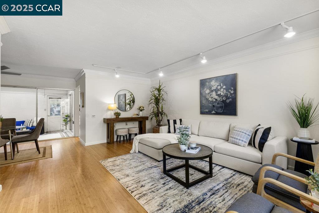 1833 Skycrest Drive, Unit 2 Walnut Creek, CA 94595 - Photo 6 of 28 a living room with furniture and wooden floor