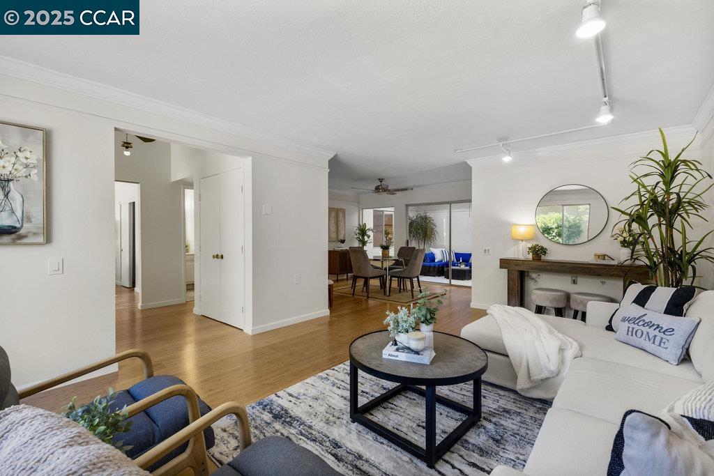 1833 Skycrest Drive, Unit 2 Walnut Creek, CA 94595 - Photo 8 of 28 a living room with furniture and a wooden floor