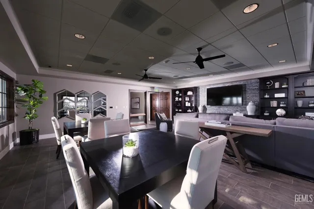 a view of a house with swimming pool and sitting area