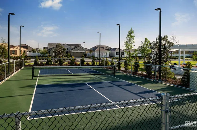 a view of a swimming pool with outdoor seating