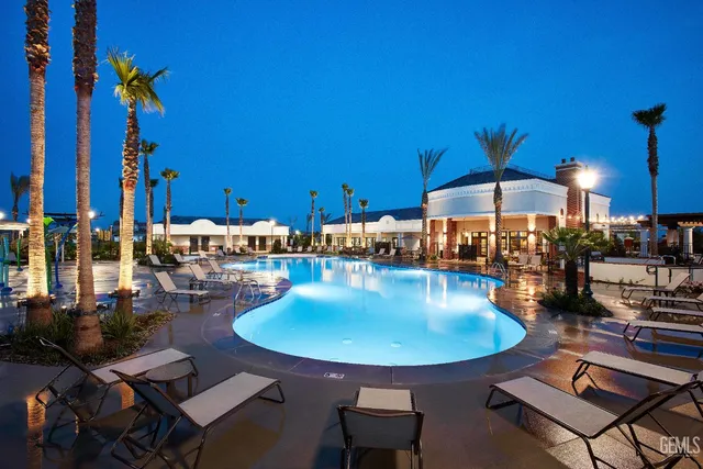 a group of people sitting in front of retail shop