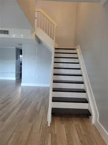 a view of entryway with wooden floor