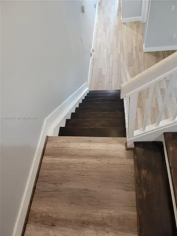 a view of entryway with wooden floor