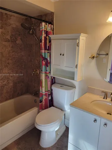 a bathroom with a sink a toilet and a bathtub
