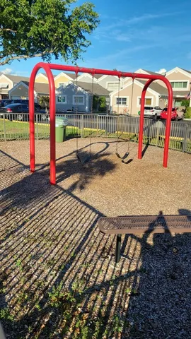 a view of a swimming pool with a bench and floor to ceiling window