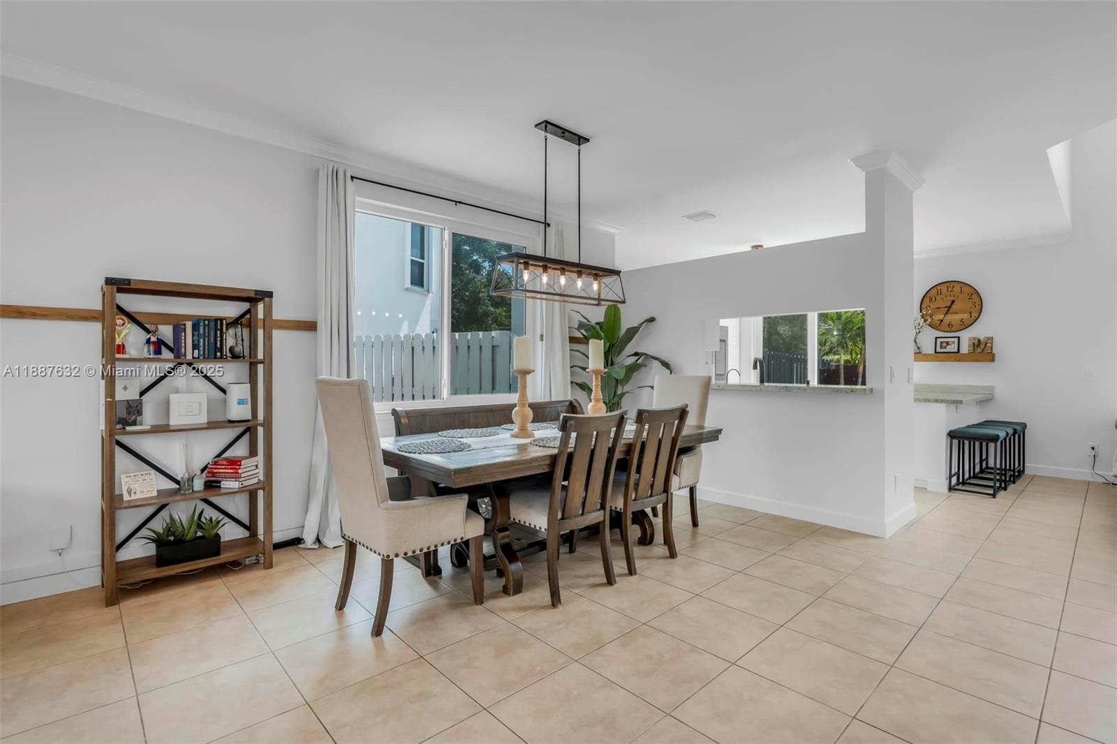 14836 Southwest 51st Street Davie, FL 33331 - Photo 11 of 34 a dining room with furniture and a floor to ceiling window
