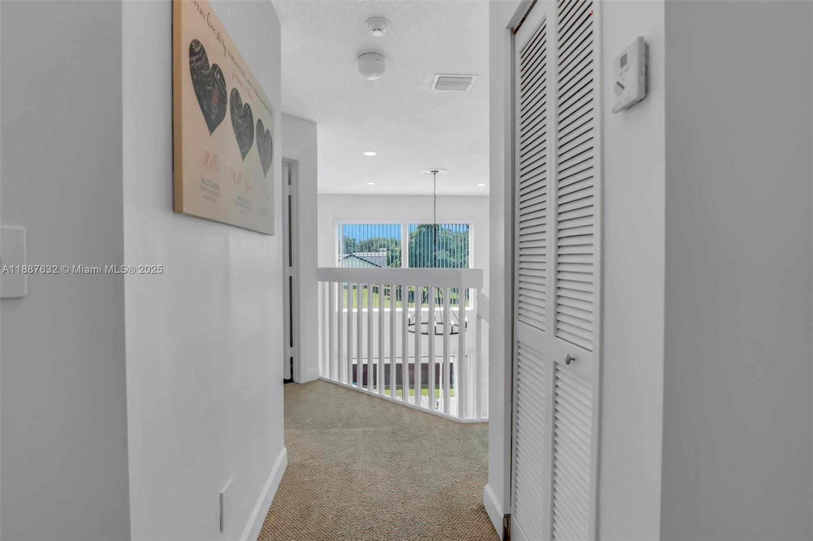 14836 Southwest 51st Street Davie, FL 33331 - Photo 15 of 34 a view of a hallway with windows
